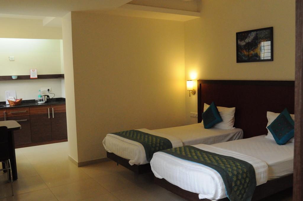 Ixora Suites Μπανγκαλόρ Δωμάτιο φωτογραφία