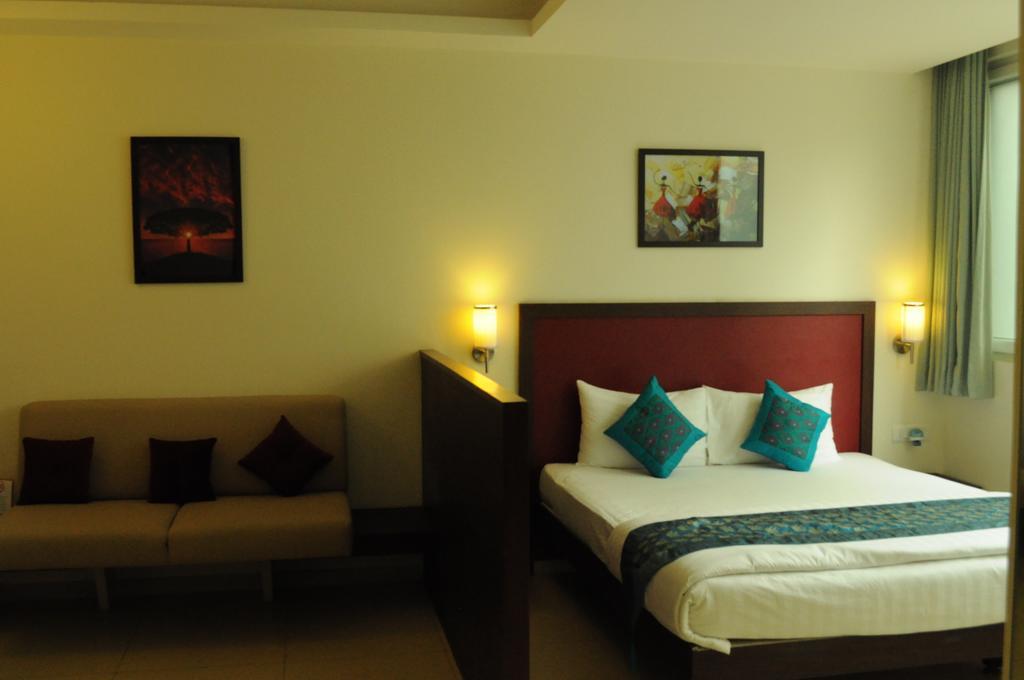 Ixora Suites Μπανγκαλόρ Δωμάτιο φωτογραφία